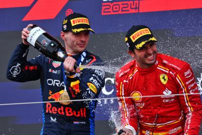(L to R): Race winner Max Verstappen (NLD) Red Bull Racing celebrates on the podium with third placed Carlos Sainz Jr (ESP)
