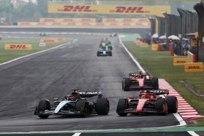 George Russell (GBR) Mercedes AMG F1 W15 and Charles Leclerc (MON) Ferrari SF-24 battle for position. Formula 1 World