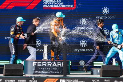 The podium (L to R): Max Verstappen (NLD) Red Bull Racing, second; Lando Norris (GBR) McLaren, race winner; Charles Leclerc
