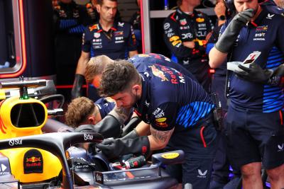 The Red Bull Racing RB20 of Max Verstappen (NLD) is worked on in the second practice session. Formula 1 World