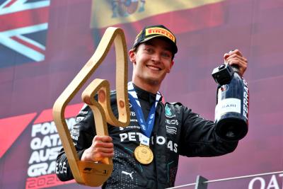 Race winner George Russell (GBR) Mercedes AMG F1 celebrates on the podium. Formula 1 World Championship, Rd 11, Austrian