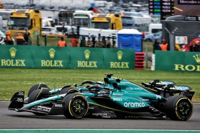 Lance Stroll (CDN) Aston Martin F1 Team AMR24 and Fernando Alonso (ESP) Aston Martin F1 Team AMR24 battle for position.