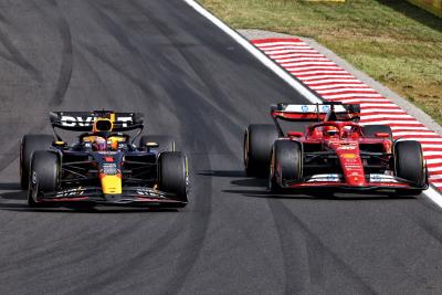 Max Verstappen (NLD) Red Bull Racing RB20 and Charles Leclerc (MON) Ferrari SF-24 battle for position. Formula 1 World