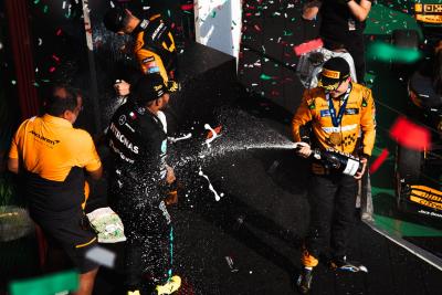 Race winner Oscar Piastri (AUS) McLaren celebrates on the podium wio second placed team mate Lando Norris (GBR) McLaren;