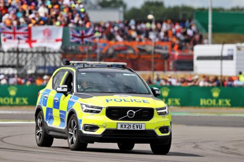 Police on the circuit at the start of the race as an incident involving people attempting to enter the circuit. Formula 1