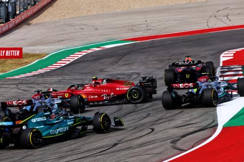 Carlos Sainz Jr (ESP) Ferrari F1-75 is hit by George Russell (GBR) Mercedes AMG F1 W13 at the start of the race. Formula 1