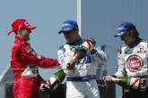 San Marino GP winner Michael Schumacher (Ferrari) on the podium with Juan Pablo Montoya (3rd) and Je