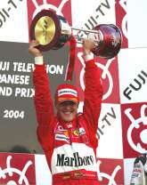 Michael Schumacher picks up another trophy for winning the 2004 Japanese Grand Prix