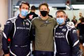 Romain Grosjean (FRA) Haas F1 Team (Centre) with Alan Van Der Merwe (RSA) FIA Medical Car Driver (Left) and Dr Ian Roberts (GBR) FIA Doctor (Right), who assisted in his escape from the fiery crash at the Bahrain Grand Prix.