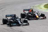 Lewis Hamilton (GBR) Mercedes AMG F1 W12 and Sergio Perez (MEX) Red Bull Racing RB16B battle for position.