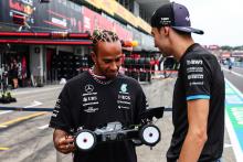 Hamilton rekindles childhood passion with remote control car race at Suzuka