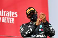 Race winner Lewis Hamilton (GBR) Mercedes AMG F1 celebrates on the podium.
