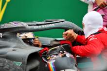 Race winner and World Champion Lewis Hamilton (GBR) Mercedes AMG F1 celebrates in parc ferme with third placed Sebastian Vettel (GER) Ferrari.