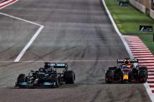 Lewis Hamilton (GBR) Mercedes AMG F1 W12 and Max Verstappen (NLD) Red Bull Racing RB16B battle for the lead of the race.