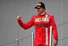 Carlos Sainz Jr (ESP) Ferrari celebrates his third position on the podium.