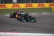 Lewis Hamilton (GBR) Mercedes AMG F1 W12 leads Max Verstappen (NLD) Red Bull Racing RB16B.