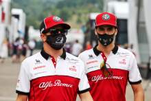 (L to R): Kimi Raikkonen (FIN) Alfa Romeo Racing with Antonio Giovinazzi (ITA) Alfa Romeo Racing.