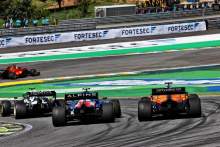 Esteban Ocon and Daniel Ricciardo battling for position