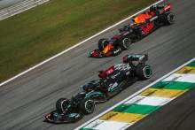 Lewis Hamilton (GBR) Mercedes AMG F1 W12 and Max Verstappen (NLD) Red Bull Racing RB16B.