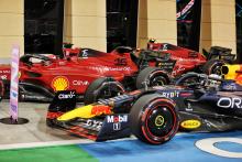 Max Verstappen (NLD) Red Bull Racing RB18 and pole sitter Charles Leclerc (MON) Ferrari F1-75 in qualifying parc ferme.