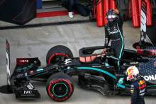 Lewis Hamilton (GBR) Mercedes AMG F1 W11 celebrates his pole position in qualifying parc ferme.