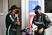 (L to R): Lewis Hamilton (GBR) Mercedes AMG F1 in qualifying parc ferme with team mate Valtteri Bottas (FIN) Mercedes AMG F1.