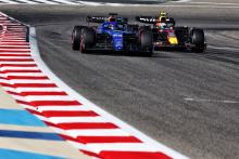 Alexander Albon (THA) Williams Racing FW45 and Sergio Perez (MEX) Red Bull Racing RB19. Formula 1 World Championship, Rd