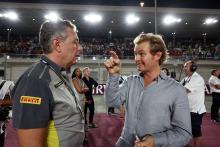 (L to R): Mario Isola (ITA) Pirelli Racing Manager with Nico Rosberg (GER). Formula 1 World Championship, Rd 18, Qatar