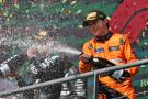 Oscar Piastri celebrates on the podium at the Belgian GP 