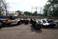 Nyck de Vries (NLD) AlphaTauri AT04 and Kevin Magnussen (DEN) Haas VF-23 run on at the exit road and reverse back on to the