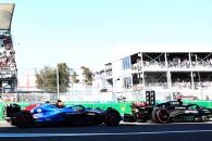 George Russell (GBR) Mercedes AMG F1 W14 stationary at the end of the pit lane with Logan Sargeant (USA) Williams Racing