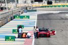 Circuit workers inspect the circuit for a damaged drain cover at turn 11. Formula 1 Testing, Sakhir, Bahrain, Day Two.-