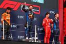 The podium (L to R): Lando Norris (GBR) McLaren, second; Max Verstappen (NLD) Red Bull Racing, race winner; Charles Leclerc