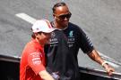 (L to R): Charles Leclerc (MON) Ferrari and Lewis Hamilton (GBR) Mercedes AMG F1 on the drivers' parade. Formula 1 World