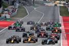 George Russell (GBR) Mercedes AMG F1 W15 leads Lando Norris (GBR) McLaren MCL38 and Max Verstappen (NLD) Red Bull Racing