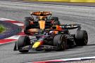 Max Verstappen (NLD) Red Bull Racing RB20 leads Lando Norris (GBR) McLaren MCL38. Formula 1 World Championship, Rd 11,